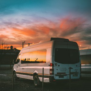 Shuttle minibus parked at dusk